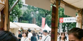 A Thai cook stir-fries noodles at an Amazing Thailand Fest food stall in Fukuoka