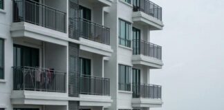 Exploring Forest City Johor: The Special Economic Zone Visa Route and Its Key Considerations Balconies of a Forest City apartment block in Johor, the Second Link bridge visible across the water