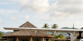 Koh Samui: Asia Pacific’s Must-See Island for 2026 Passengers walk from an aircraft to Koh Samui's open-sided airport terminal past a baggage cart