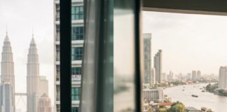 MM2H vs Thailand LTR: Key Differences and What You Need to Know Before Choosing Your Residency Option Split image of a woman relaxing on a Kuala Lumpur balcony beside a man working from a Bangkok apartment