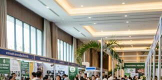 Pattaya 2026: Where Sustainable Wellness Tourism Redefines Escape A Thai exhibitor talks with a buyer at a Thailand Travel Mart stand signed Wellness and Regenerative Tourism
