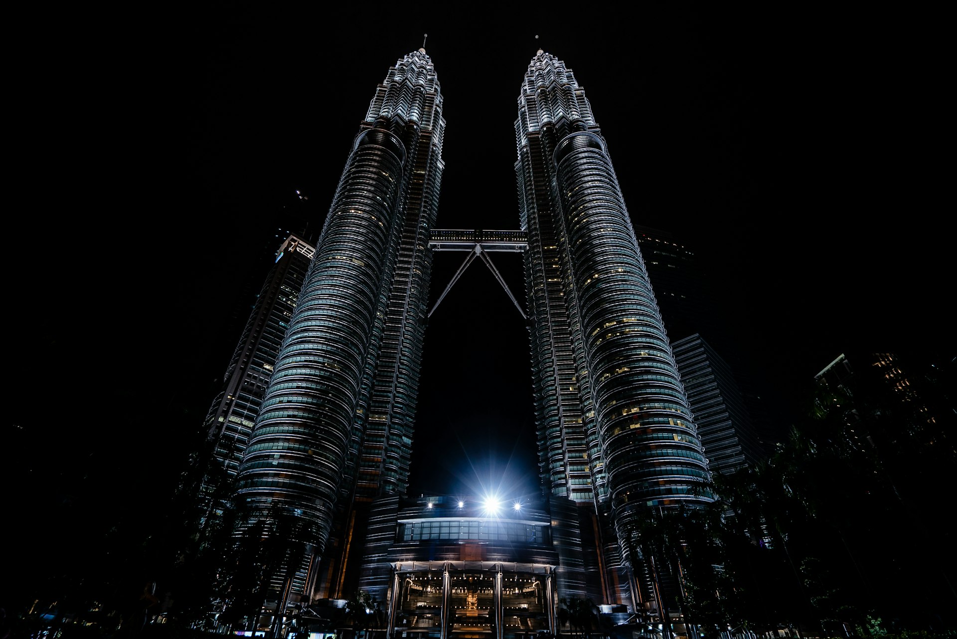 The Petronas Twin Towers lit up at night in Kuala Lumpur